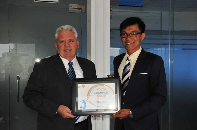 Tong Soprach Received The Youth Champion Award from Dr Marc G. L. Derveeuw, UNFPA Cambodia Representative, February 2016. 